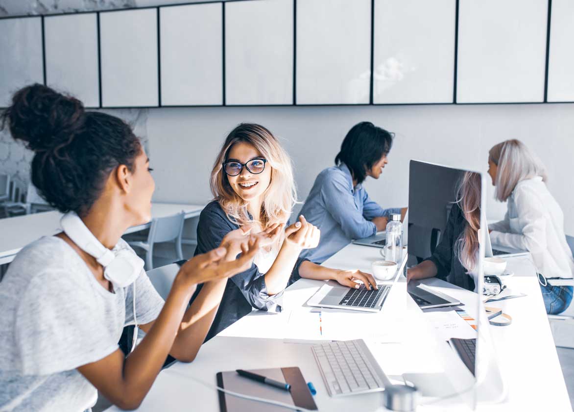 Image of a group of people within an open office workspace